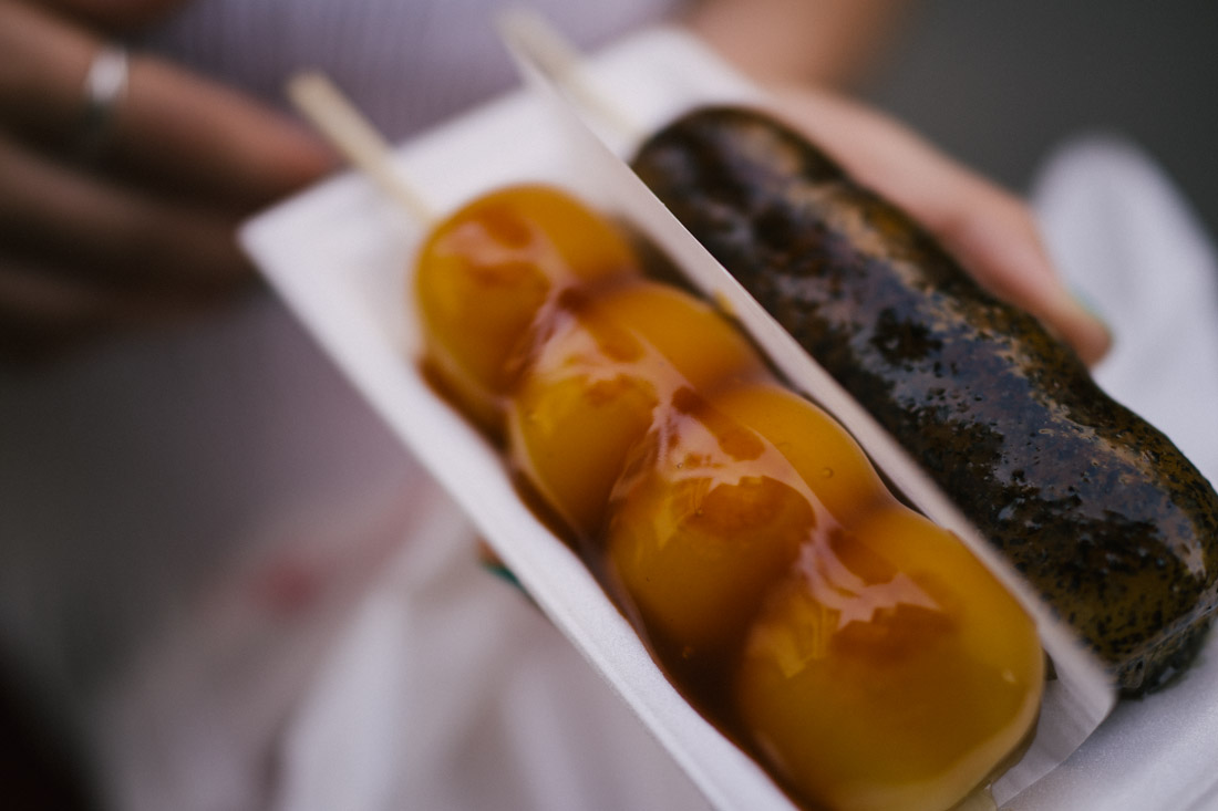 Dango; traditional sugar and soy sauce on the left, sesame sauce on the right.