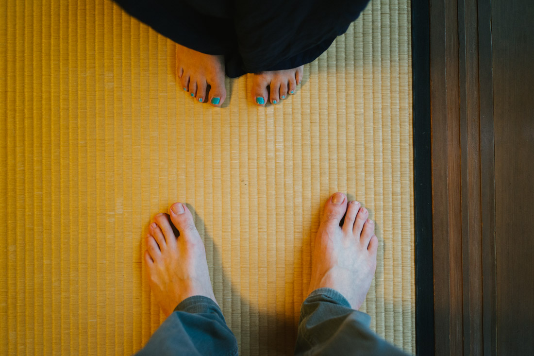 You can not step on a tatami mat with your slippers on, you must be barefoot to walk inside the room.